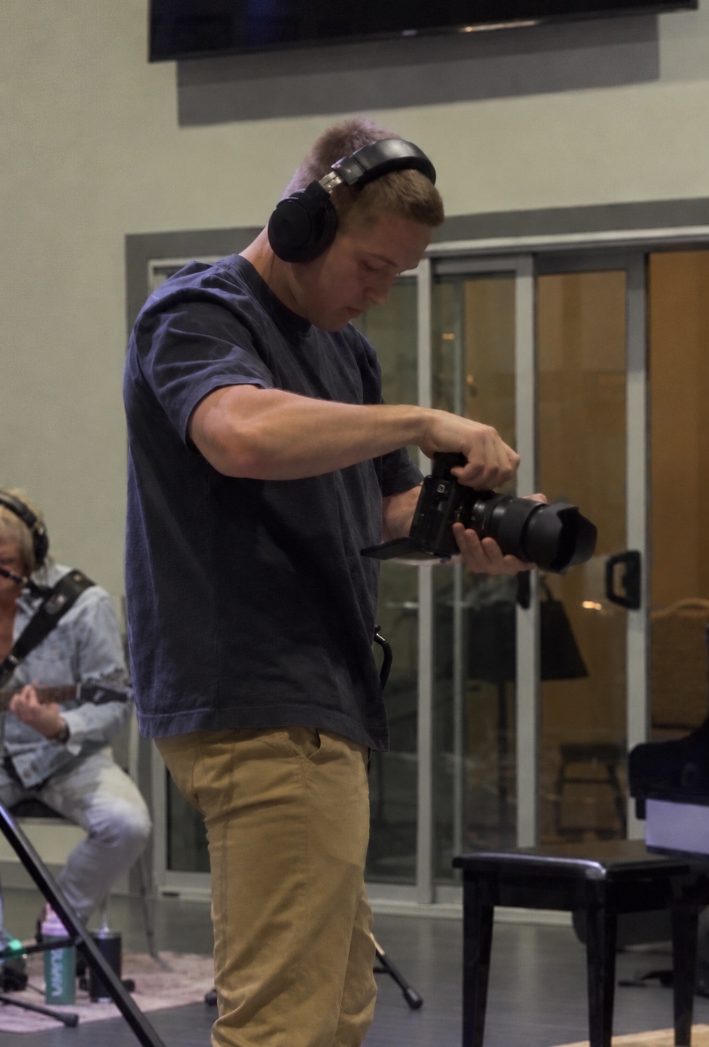 Gavin, the founder of Known Owner, holding his camera